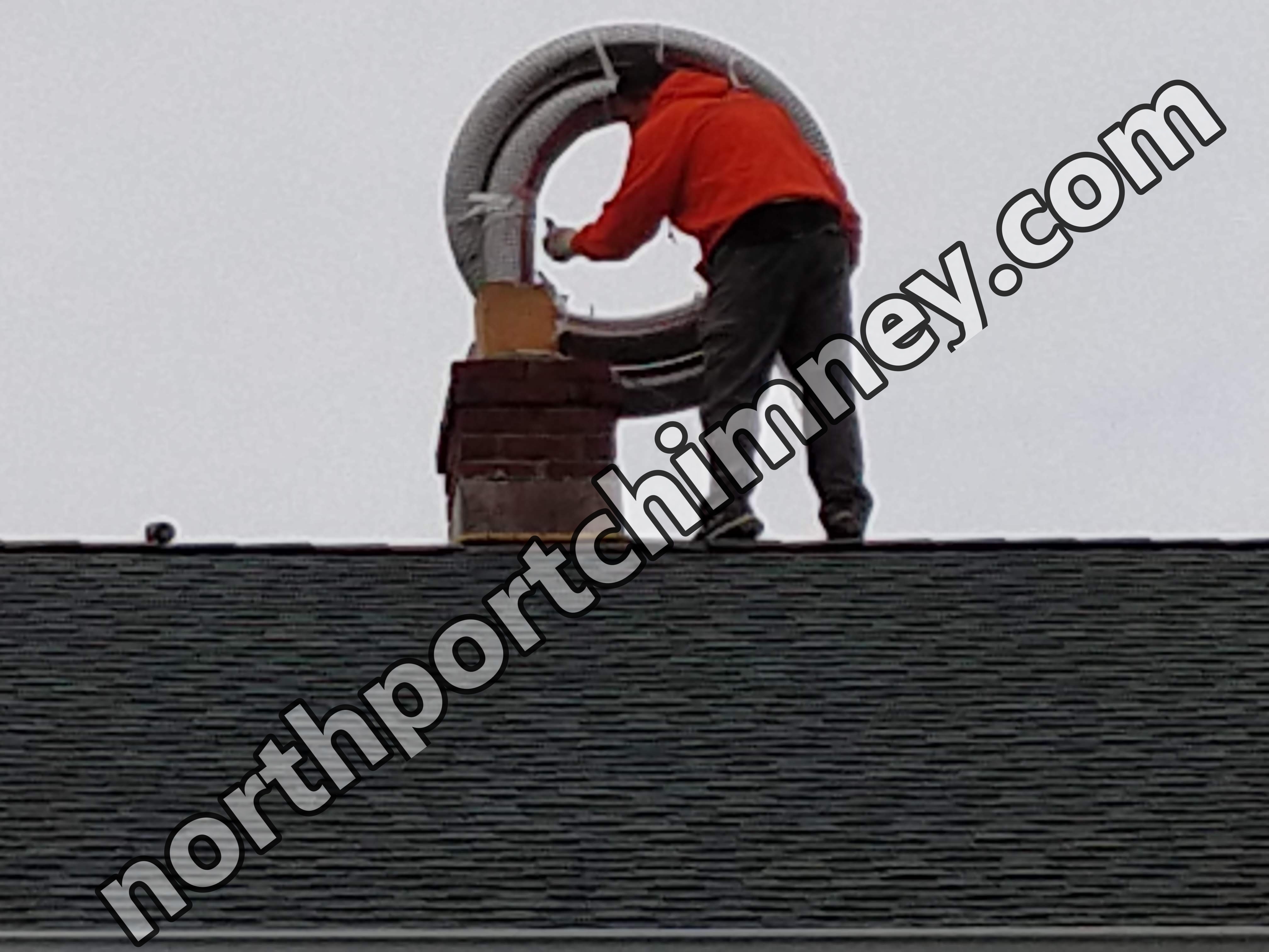 Flexible stainless chimney liner being installed in Huntington, New York