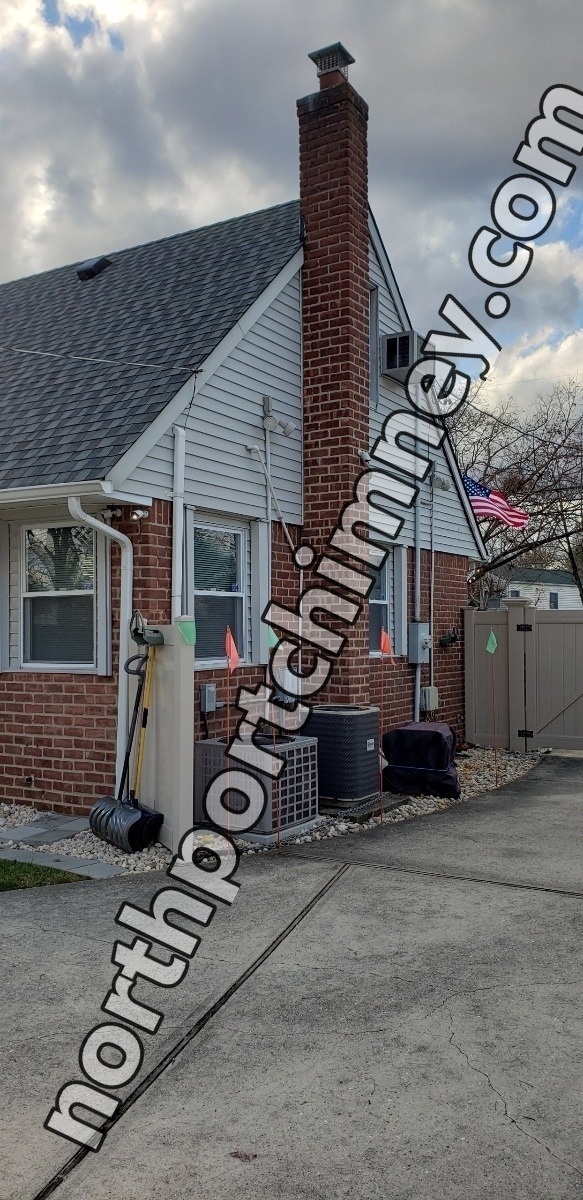 Professional chimney repointing restoring brick joints in Northport, NY